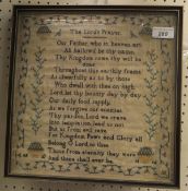 An early 19th Century needlework sampler by Ann Locke, dated 1814, featuring The Lord's Prayer,