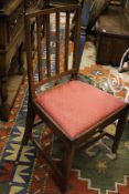 A set of seven (6+1) 19th Century mahogany framed slat back dining chairs with drop in seats,