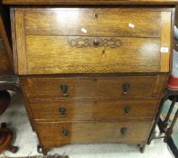 A 20th Century oak bureau of three drawers, a small oak gate-leg coffee table,