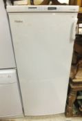 A Haier HF-248/B freezer together with a Beko compact cooker