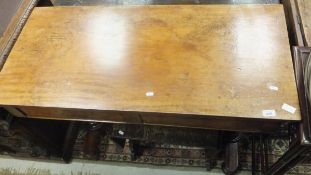 A Victorian mahogany serving table, the top with folding leaf to the back,