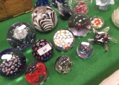 A collection of glass paperweights to include Caithness "Love Hearts", Caithness "Twirl",