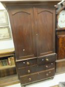 A Victorian mahogany linen press, the top with two doors opening to reveal a hanging space,