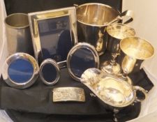 A collection of silver and plated wares to include a silver mounted rectangular photograph frame,