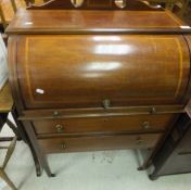 An Edwardian mahogany and inlaid cylinder top desk,