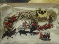 A painted metal Coronation set including Royal carriage, horses and various figures,