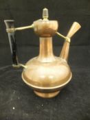 A circa 1900 Benham & Froud of London copper and brass coffee pot, raised on a circular foot,