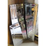 Three frameless multi-panelled wall mirrors with bevelled edges