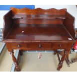 A mahogany washstand with three quarter galleried top above three short drawers,