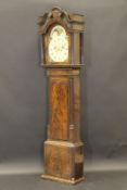 A George III mahogany long case clock with swan neck pediment above body with flamed mahogany door,