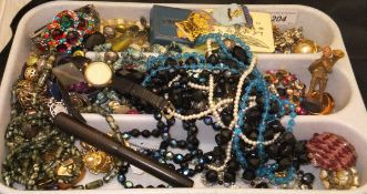 A tray containing a collection of costume jewellery, to include necklaces, earrings, wristwatch,