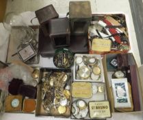 A large collection of various watch parts including cases, faces, movements, glasses,