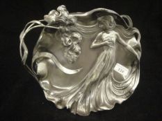 A WMF embossed pewter dish decorated with maiden in flowing robes, No'd.