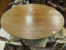 A 19th Century mahogany oval tilt-top table on quadruped base,