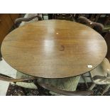 A 19th Century mahogany oval tilt-top table on quadruped base,
