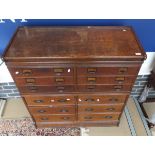 An oak two part chest in the Globe Wernicke manner,