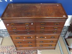 An oak two part chest in the Globe Wernicke manner,
