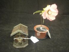 An unusual German novelty clock as a potted flower,