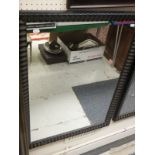 Two rectangular wall mirrors with black painted frames