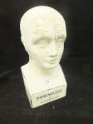 A glazed pottery phrenology head inscribed "Phrenology by LN Fowler - Entered at Stationer's Hall -