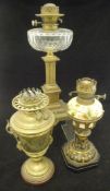 A 19th Century oil lamp, the cut glass reservoir on a brassed columnar base to square foot,