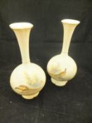 A pair of Royal China Works Worcester blushware stem vases of baluster form,