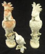 A pair of Czechoslovakian Royal Dux porcelain figures of cockatoos,