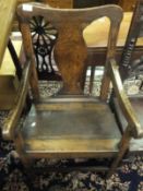 A 19th Century provincial oak elbow chair in the Hepplewhite taste,