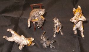 A collection of five painted lead flash metal figures of cats, three playing musical instruments,