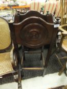 An early 20th Century mahogany framed rocking chair with canework seat and back,