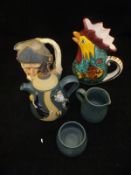 A crate containing a collection of miscellaneous china wares to include an art pottery teapot,