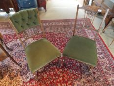 A Victorian rosewood salon chair with shaped carved and pierced backsplat and green upholstered