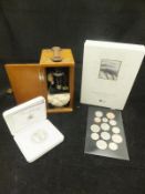 A box containing a 2011 Royal Commemorative £5 coin contained in a "The Royal Mint" box,