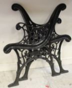 Two painted cast iron garden bench ends
