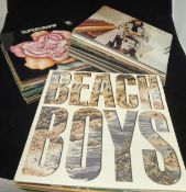 A collection of various LP records including Eric Clapton, Roger Waters, Beach Boys, Shadows,