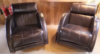 A pair of modern brown leather upholstered rocking armchairs in the Art Deco taste