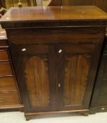 A early 19th Century mahogany cupboard,