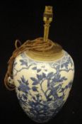 A Chinese porcelain jar decorated in under glaze blue with birds amongst branches (converted to a