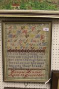 A 19th Century needlework sampler by Louise Hamer, aged 12 years, dated 1883,