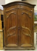 A late 18th / early 19th Century French walnut armoire,