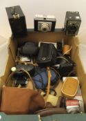 A box of vintage cameras and camera equipment to include box Brownie, a Kodak Brownie 127,