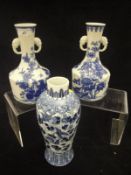 A Chinese porcelain baluster shaped vase decorated in blue and white with butterflies and scrolling