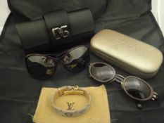 A pair of ladies Dolce and Gabbana sunglasses with case,