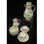 A 19th Century Meissen floral encrusted coffee pot with small jug,