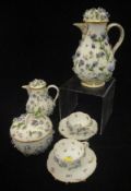 A 19th Century Meissen floral encrusted coffee pot with small jug,