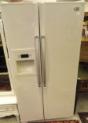 An LG premium EZ digital American style fridge together with a pair of single beadsteads with