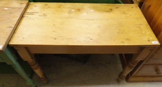 A pine side table, the rectangular top on turned and ringed legs,