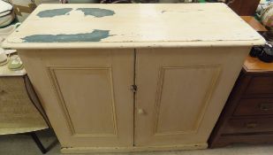 A cream painted cupboard,