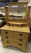 A late Victorian pine dressing chest with mirrored superstructure over three drawers