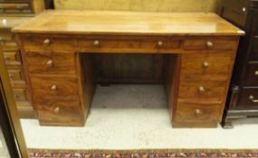 A modern Eastern hardwood pedestal desk,